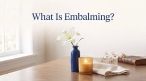 What is embalming illustrated by a calm, dignified funeral home preparation setting with soft lighting, conveying care and professional preservation of the deceased