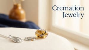 Cremation jewelry collection: memorial pendant, ring, and glass keepsake holding a loved one's ashes
