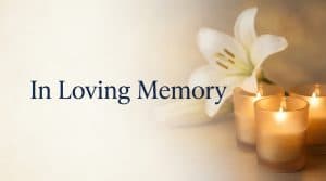 The phrase In Loving Memory set in elegant type over a soft, respectful memorial background in navy blue and warm amber